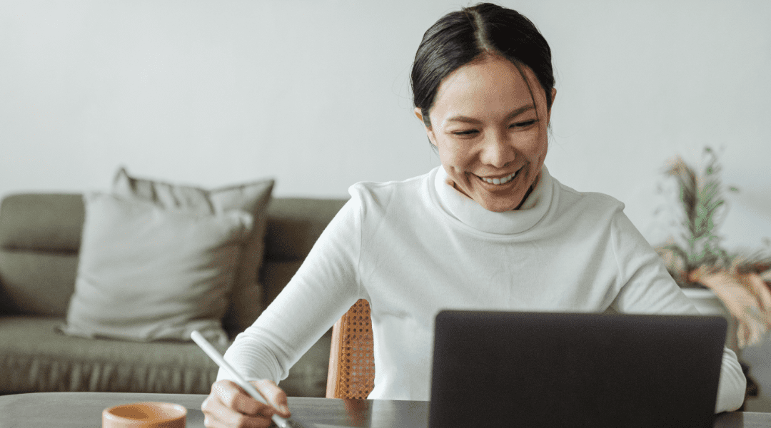 happy woman using laptop