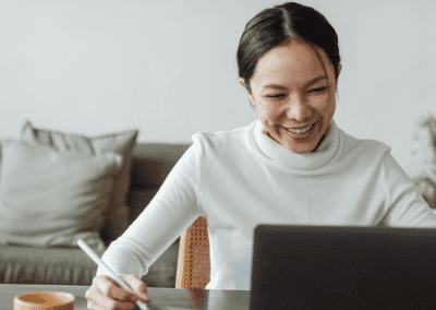 happy woman using laptop