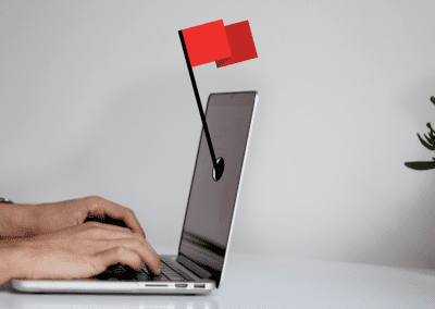 laptop and a red flag