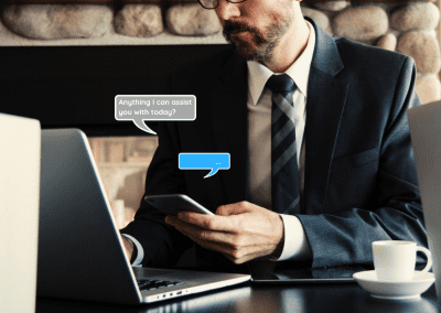 businessman working in cafe and holding cellphone