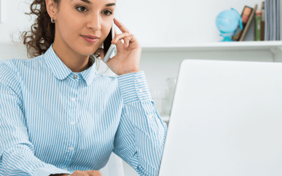 woman on the phone in a very bright office