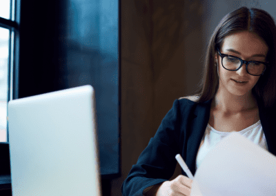 woman working on papers in office