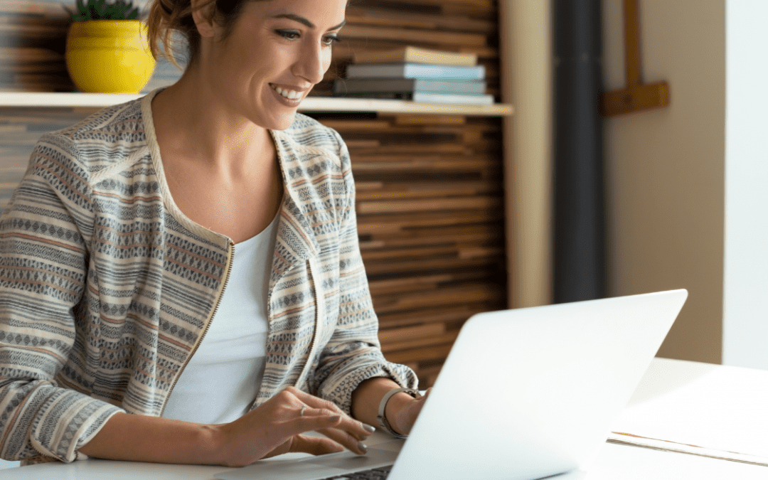 woman in office working at laptop