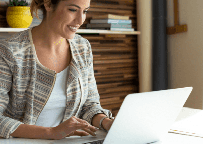 woman in office working at laptop