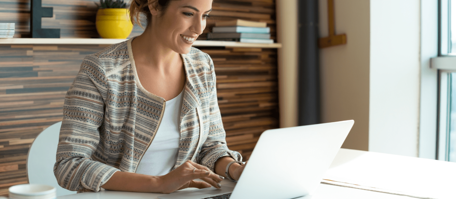 woman in office working at laptop