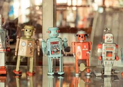 line of 6 metal toy robots