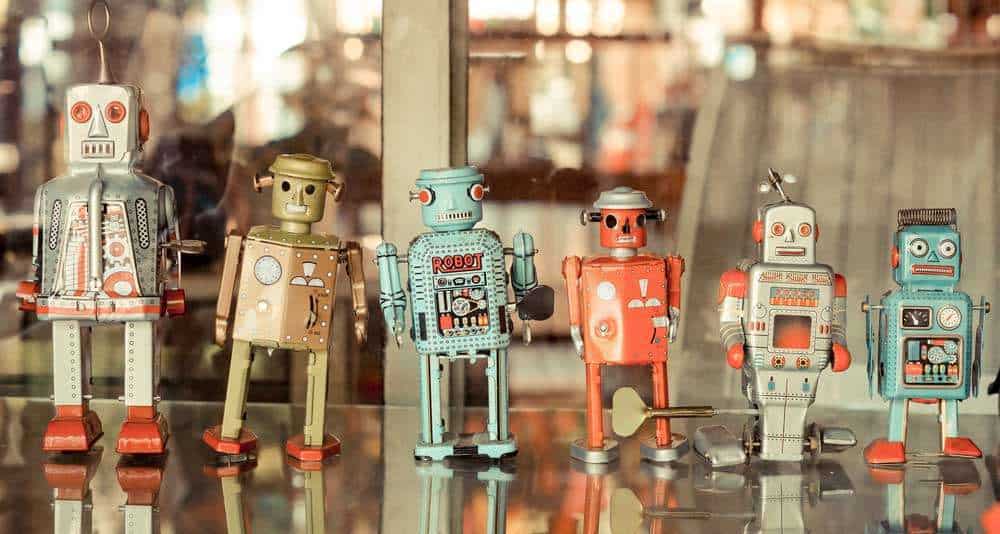 line of 6 metal toy robots