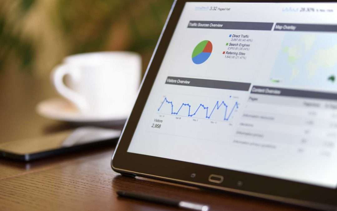 Tablet with financial metrics on screen