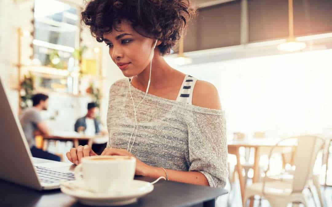 casual woman typing in cafe