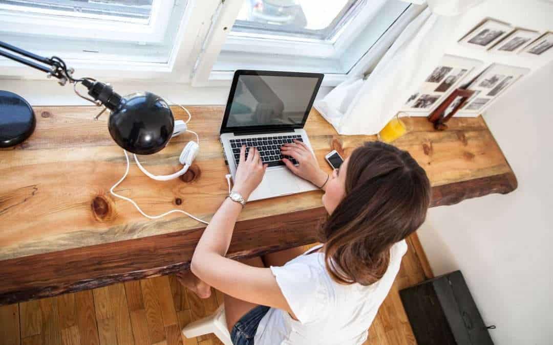 woman at a desk with a laptop