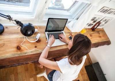 woman at a desk with a laptop