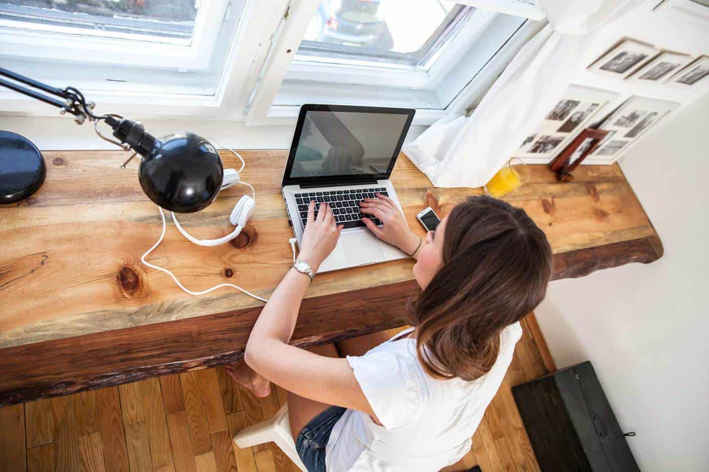 woman at a desk with a laptop