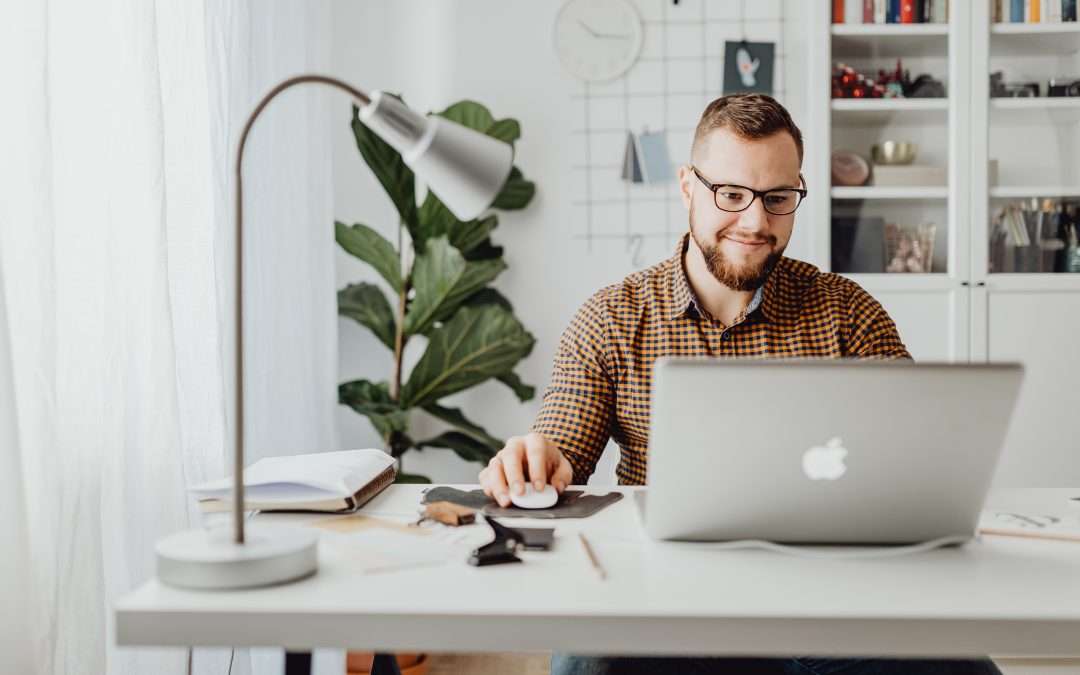 man working in the real estate office on computer