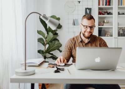 man working in the real estate office on computer