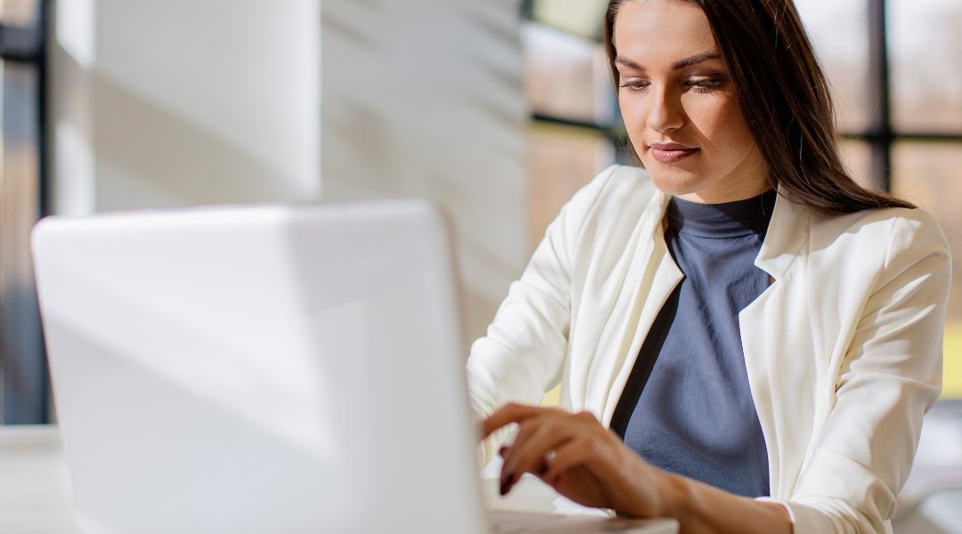 women looking at her email on the computer