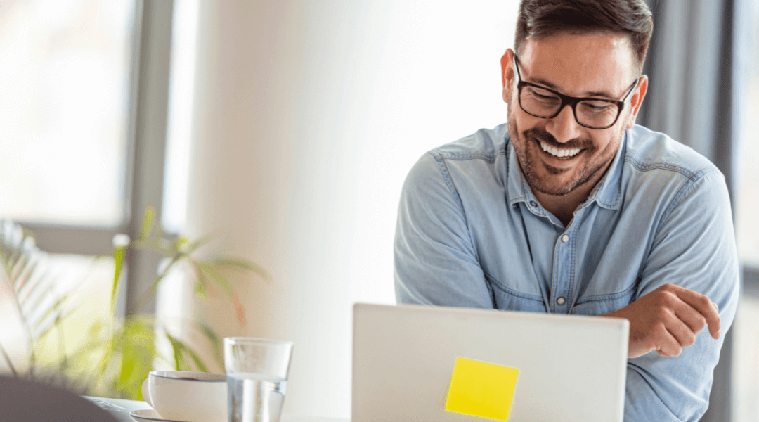 Male business owner looking at the computer