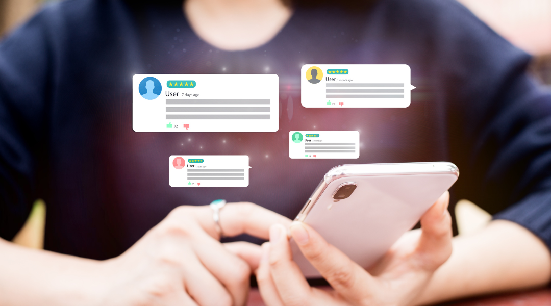 A woman holding a cell phone with several speech bubble icons showing ratings floating around it.