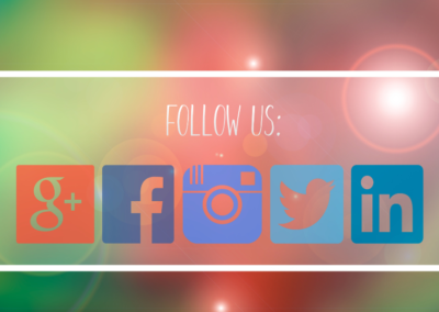 Multicolored social media icons under the words "Follow Us" on a blurred, brightly colored background.