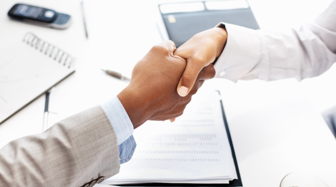 Handshake between a man and a woman.