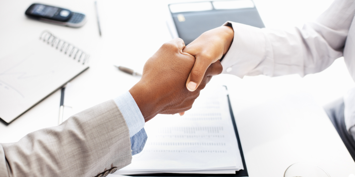 Handshake between a man and a woman.