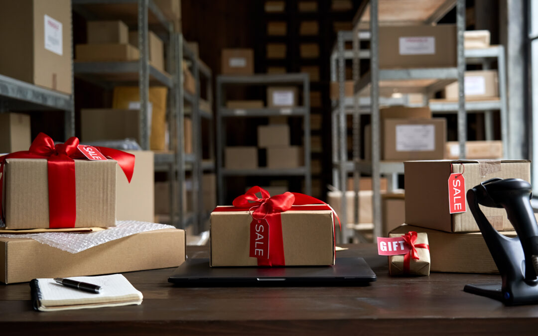 Warehouse with a stack of holiday boxes ready to ship on a desk.