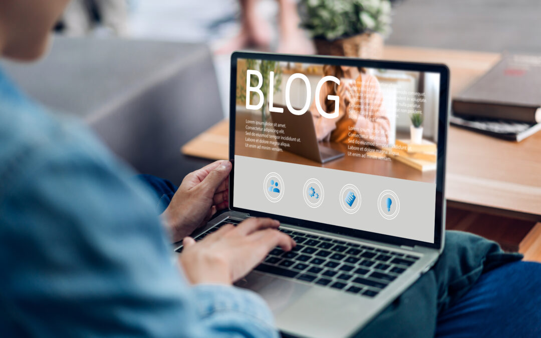 Woman using a laptop computer to blog.