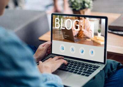 Woman using a laptop computer to blog.