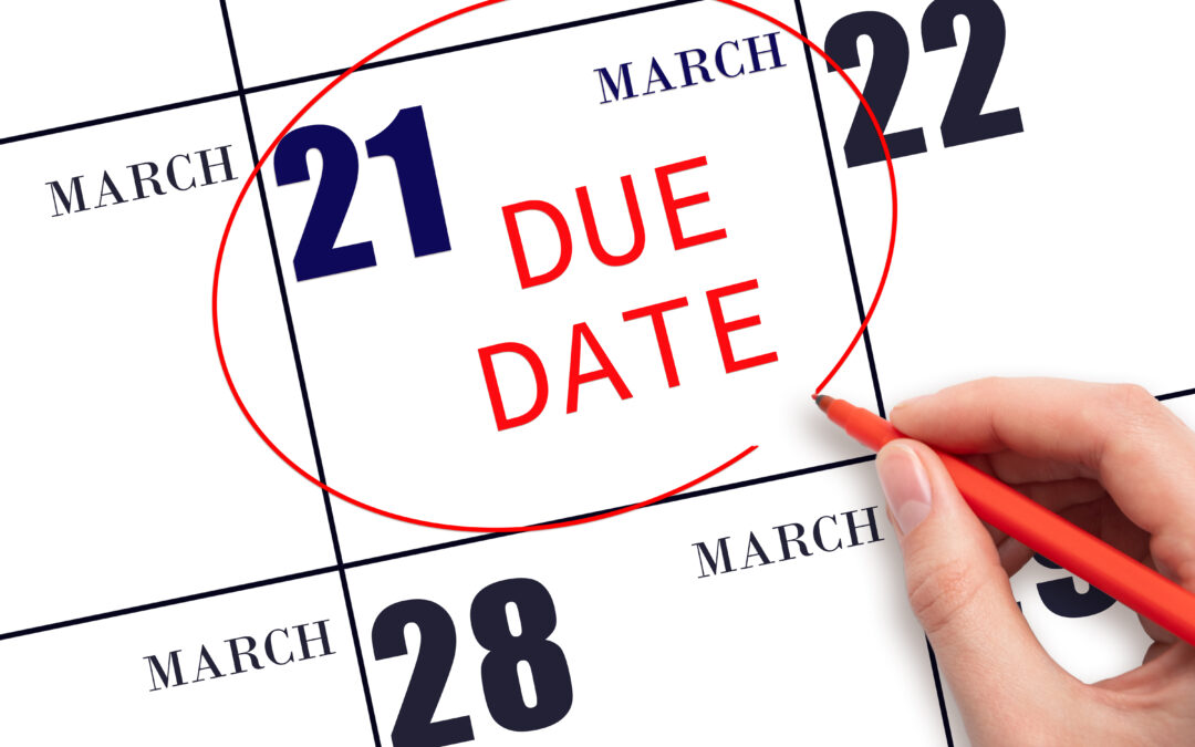 Writing text DUE DATE on calendar date March 21 and circling it.