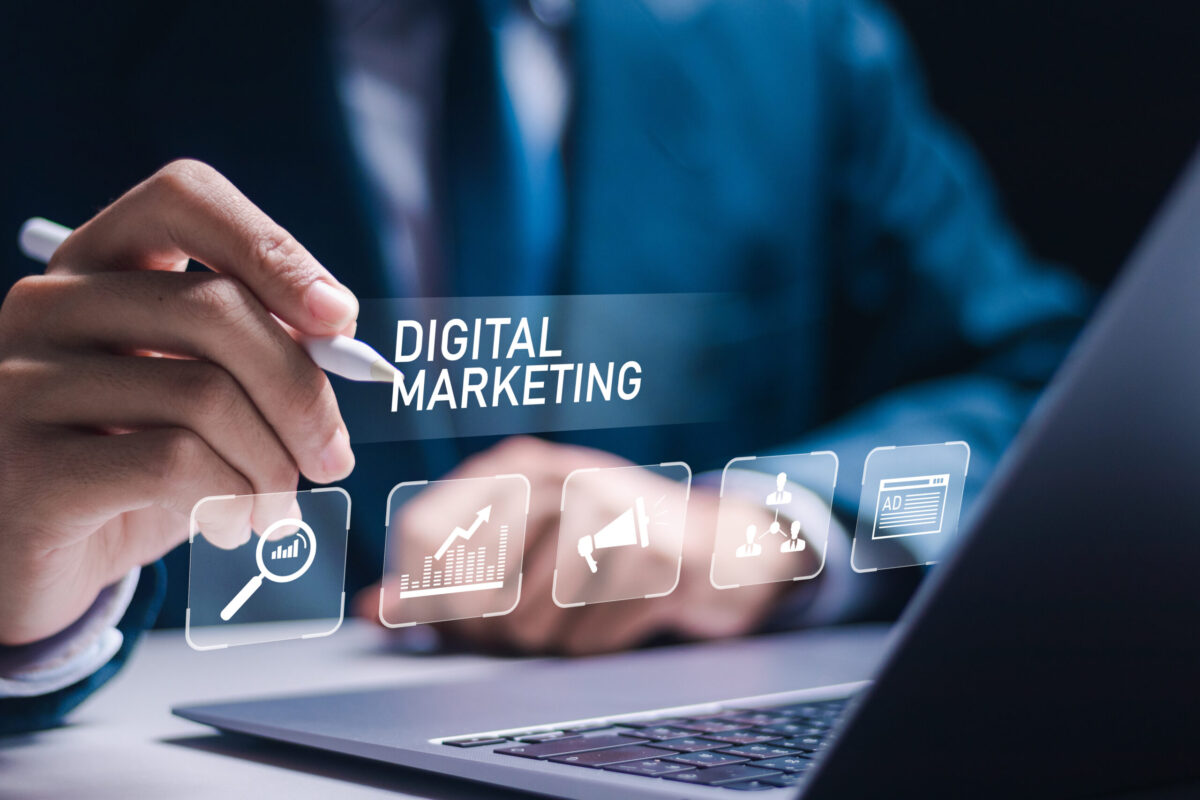 Litigation Attorney using laptop with virtual digital marketing icons.