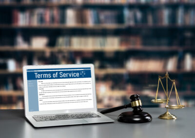 Attorney's office with laptop displaying website terms of service, symbolizing law firm website compliance and security.