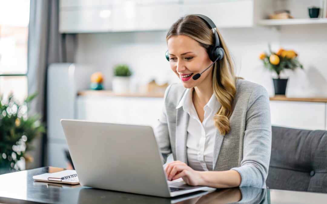 Remote legal receptionist working at laptop and answering calls.