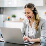 Remote legal receptionist working at laptop and answering calls.