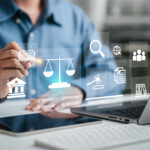 Attorney working on a large discovery project, using a laptop with a legal services icon.