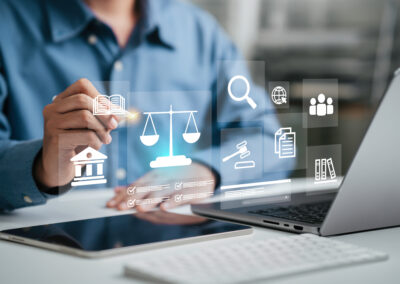 Attorney working on a large discovery project, using a laptop with a legal services icon.