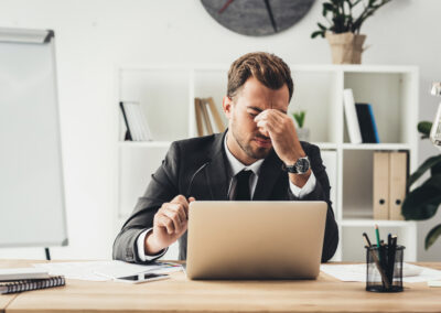 Tired attorney at desk.
