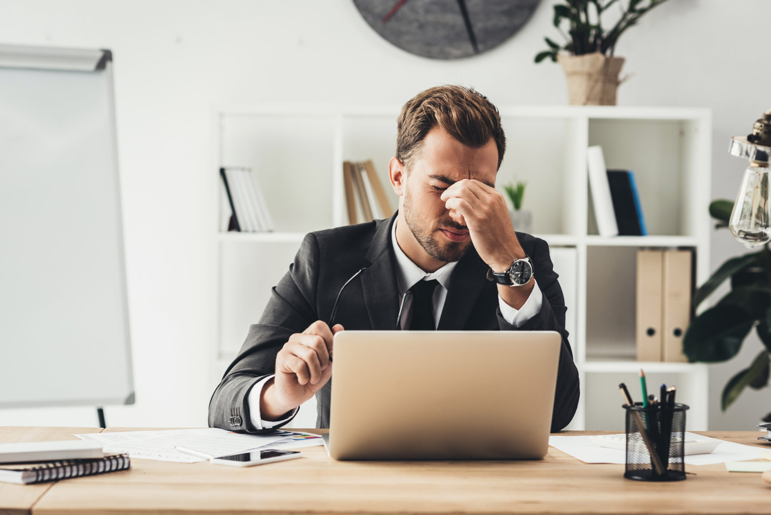 tired businessman at workplace Tired attorney at desk.