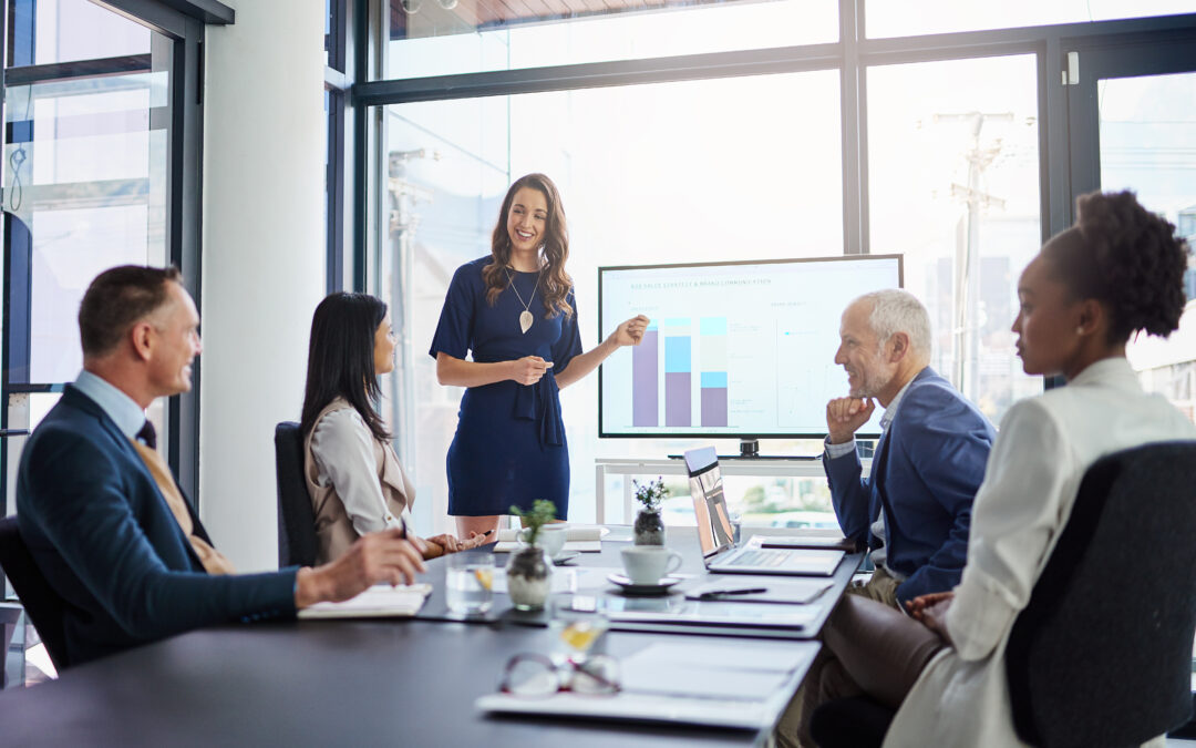 Legal team watching a presenter explain how to grow a law firm while keeping costs down.