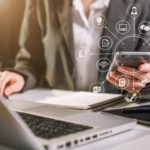 Attorney working with smart phone and laptop