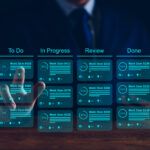 Agile software development or project management using kanban or scrum methodology boards on screen. Process, workflow, visual organisation tools and framework. Developer touching virtual interface.