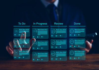Agile software development or project management using kanban or scrum methodology boards on screen. Process, workflow, visual organisation tools and framework. Developer touching virtual interface.